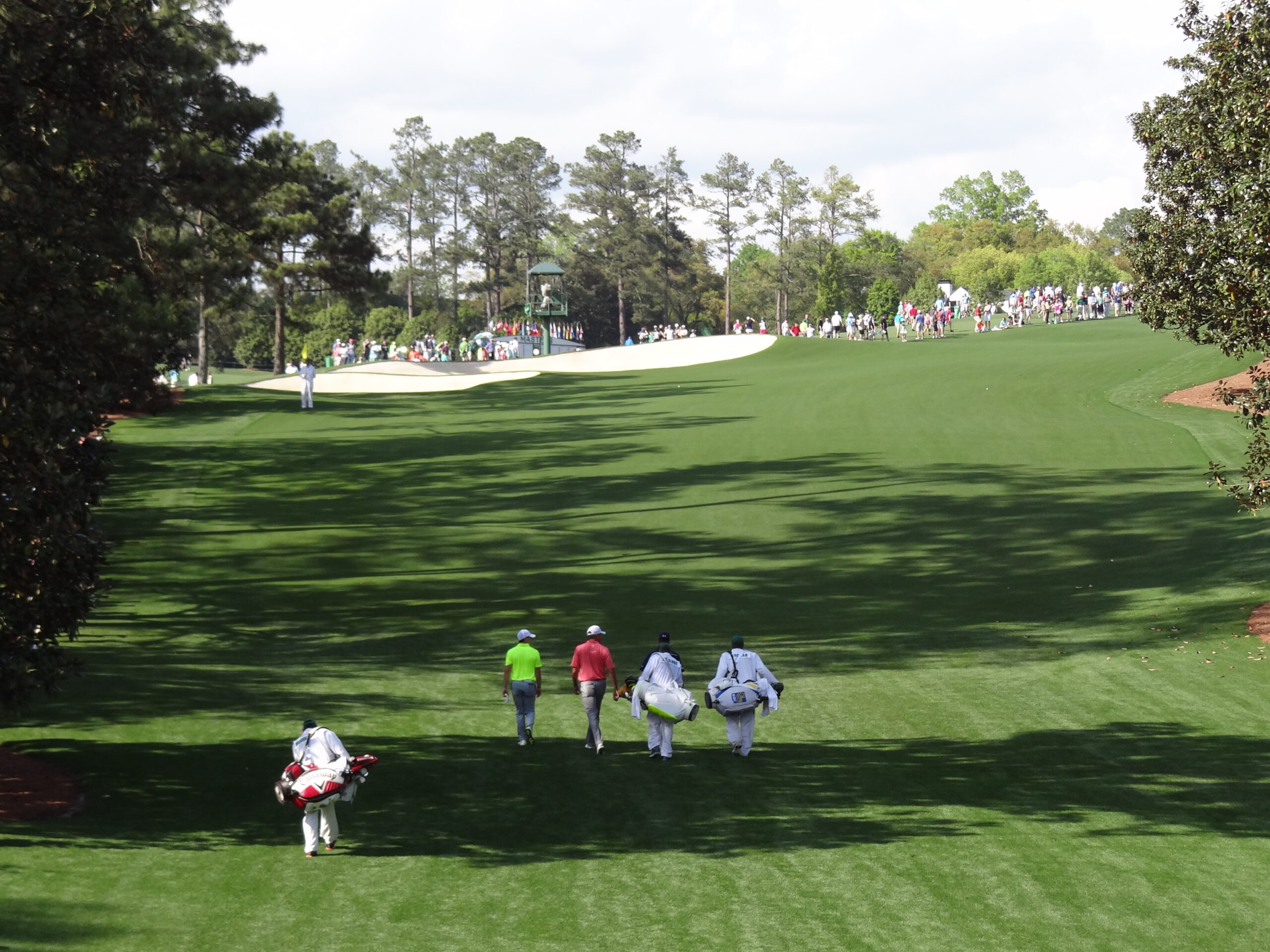 Masters players walking 18th fairway during practice round